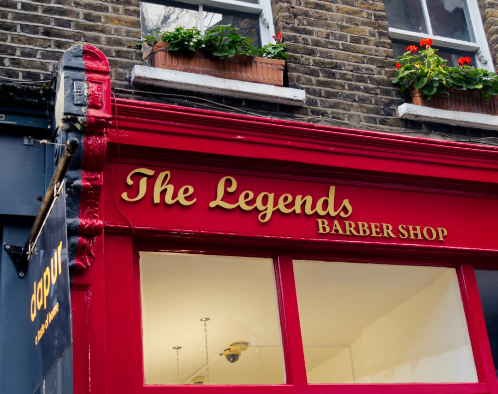 The red frontage of The Legends Barbershop