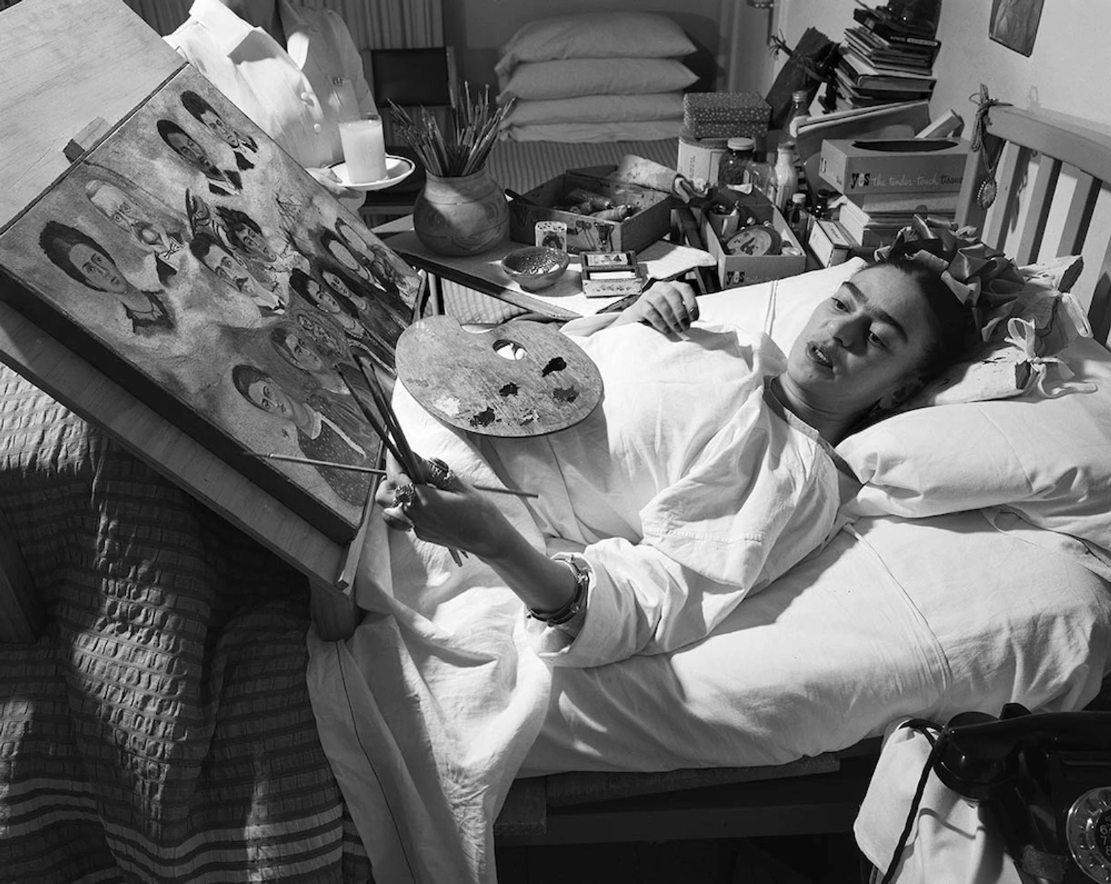 Frida painting in her bed