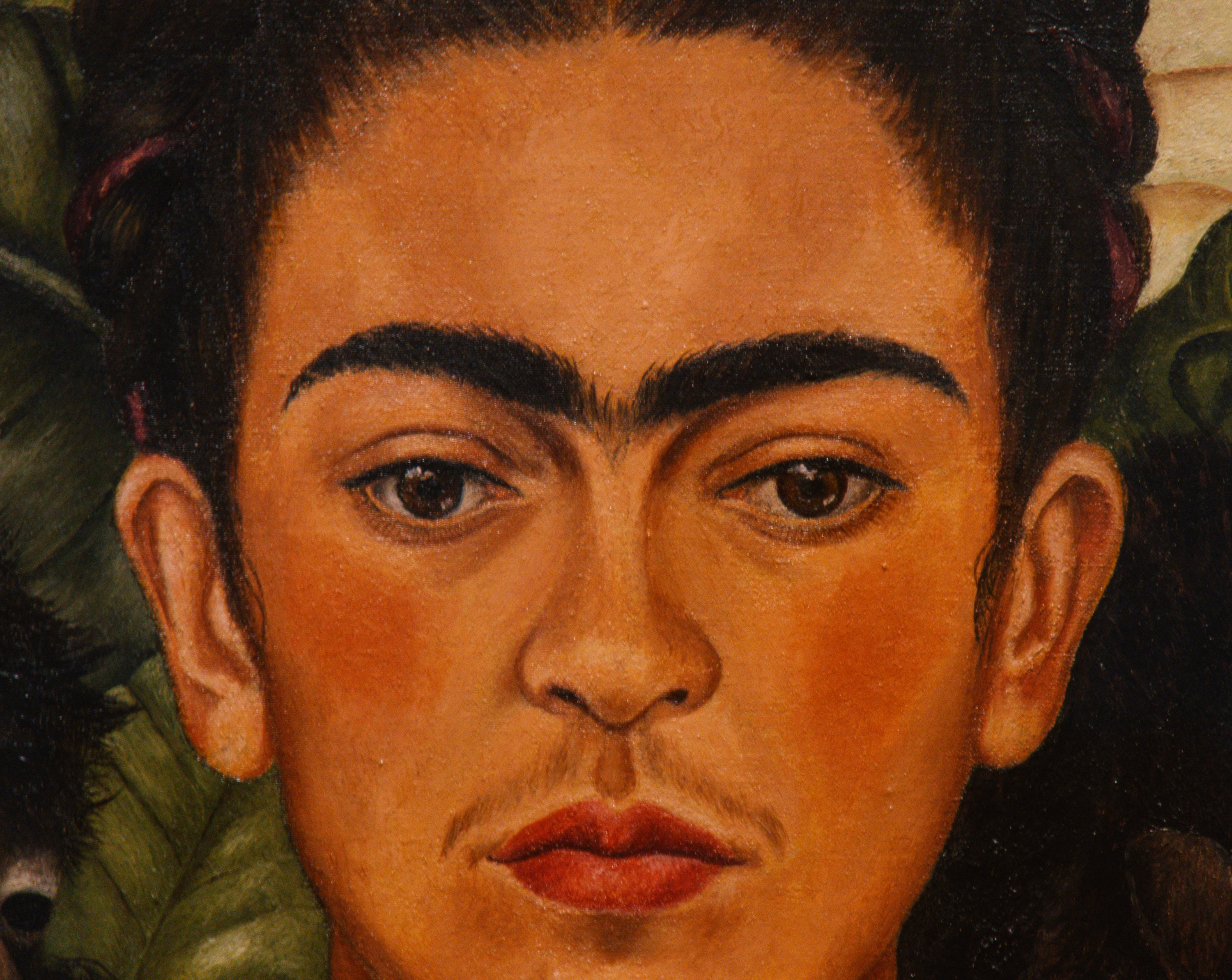 Close-up of Frida Kahlo's painted face