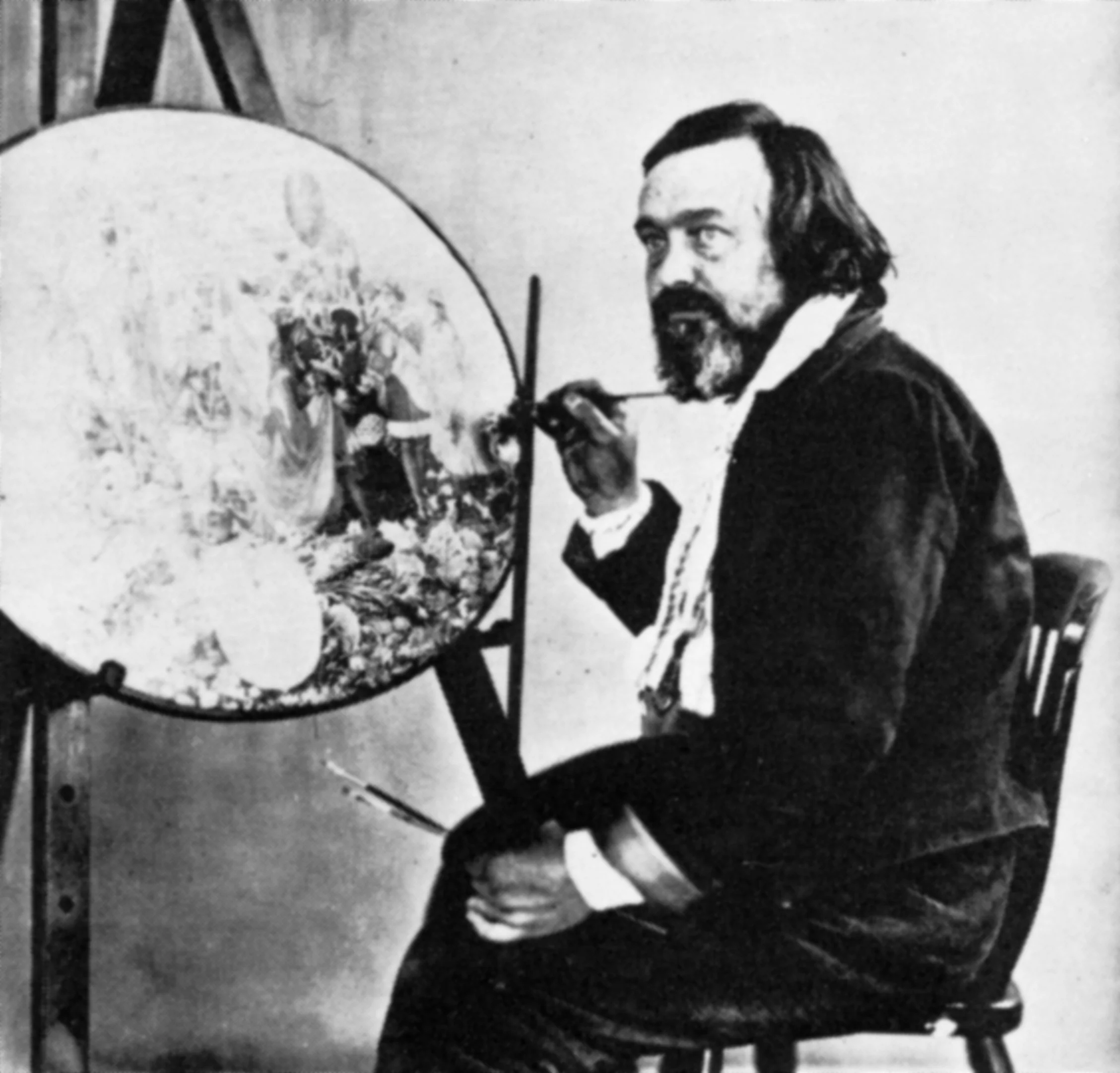 Richard Dadd painting, holding brushes beside his canvas
