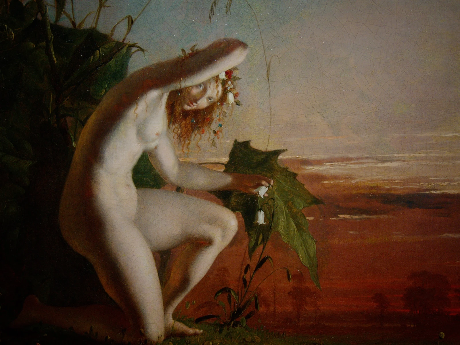 A seated fairy beneath a crescent moon in The Haunt of the Fairies