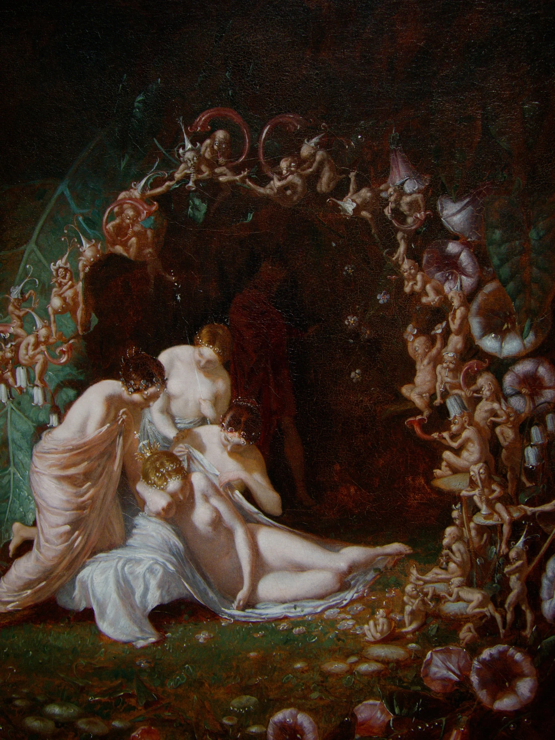 Titania asleep among flowers and fairies
